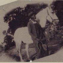 man w ith white horse