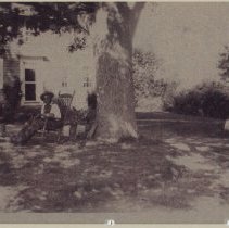 man in chair in yard