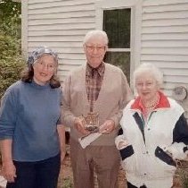 Three unidentified people  (Landry?)