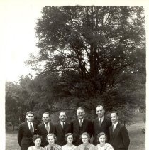 group, women seated, men standing