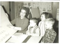 Miss Emmons with three children