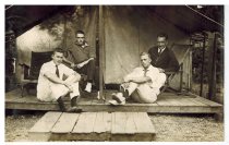 Four men in a tent