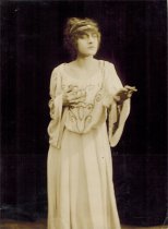 A sepia photo of a woman posing