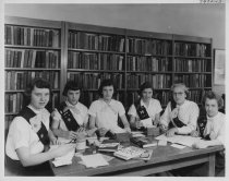 Girl Scouts sitting around a table-1