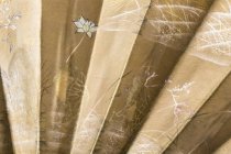 detail of front, two frogs with flowers