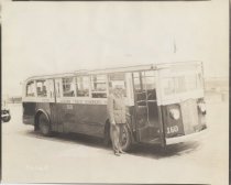 Borough President Joseph A. Palma next to a bus, 1936