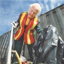 M2014.1.1103-McCallion Picking up Garbage