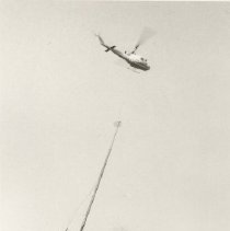 Helicopter transporting utility pole