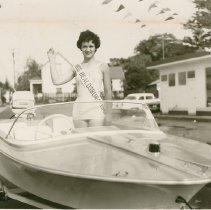 Karen Clary with Outboard Motorboat