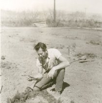 Bill Wallace Inspecting Grapevine