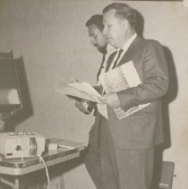 Homer Hoyt Demonstrates New Film Projector