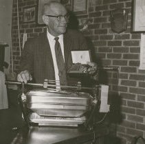 Frank Thrall Shows Prune Pie Baking Contest Prize