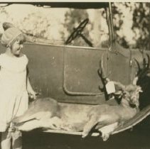 Two Children with Shot Deer