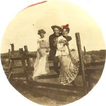 Unknown group of three on fence