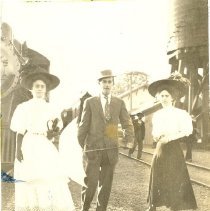 Unknown man and women at train depot