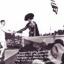 Ed Beeson Accepts Medal from Queen Virgilia