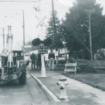 Workers at Railroad Tracks