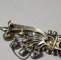 Close up of brooch signature