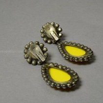 Back view of earrings, showing signature