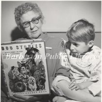 Hospital Volunteer Reading to Patient