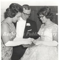 Adjusting Flower on Fan at Cotillion