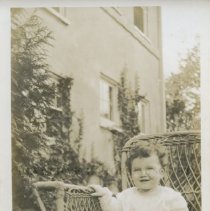 Baby Alice in Wicker Chair