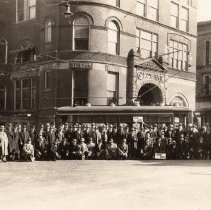 Group in front of City Hall, sign says 1891-1931
