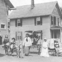 Chisolm sisters and Phyllis Tulipani.  Tulipani house in background