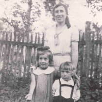 Gabrielle sitting, sister Olga, brother Ernest and mother Sara