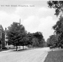 Main Street (dirt road) and old Town Hall looking south