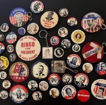 Assortment of political campaign buttons and keychains