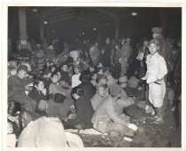 "Japanese refugees crowd Tokyo Station platform awaiting incoming trains