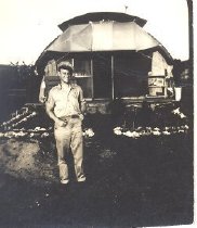 Man in uniform in front of building in Saipan