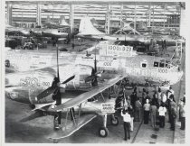 Employees attaching money to contribute to the March of Dimes; $10,562 were