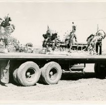 Black and white print of Native dancers on a platform