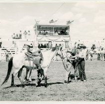 Joan Shoemaker shaking hands with another woman