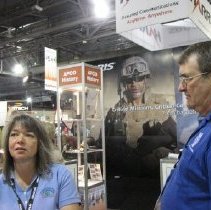 Rich Rybicki and Jackie Jones working the APCO historical booth.