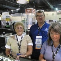 Rich Rybicki, Jackie Jones and Lin Ford working the APCO historical booth.
