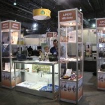 APCO historical booth display with Lin Ford and Rich Rybicki.