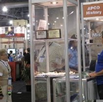 Lin Ford making sure a tower display is explained to a conference attendee.