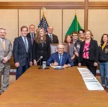 The signing of HB-1055