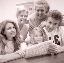 Carol Laden (standing) and children