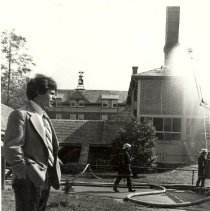 24.Music teacher Chris Simons looks at fire fighters