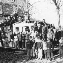 22.Chestnut Hill Academy Junior School students climb on 1948 "pumper'"