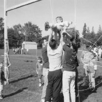75.All School Day: first grader Kevin Rosen is tossed over spider web