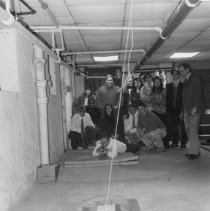 77.Physics teacher Marty Baumberger (right) with students