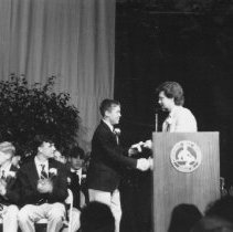 71.Middle school head Tim Bazemore congratulates 8th grade class speaker