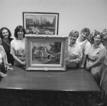 39.CHA art auction committee members admire painting