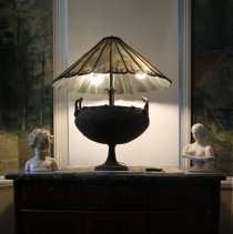 Assemblage of objects including bust of woman