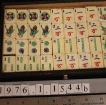 Mah jong tiles in box